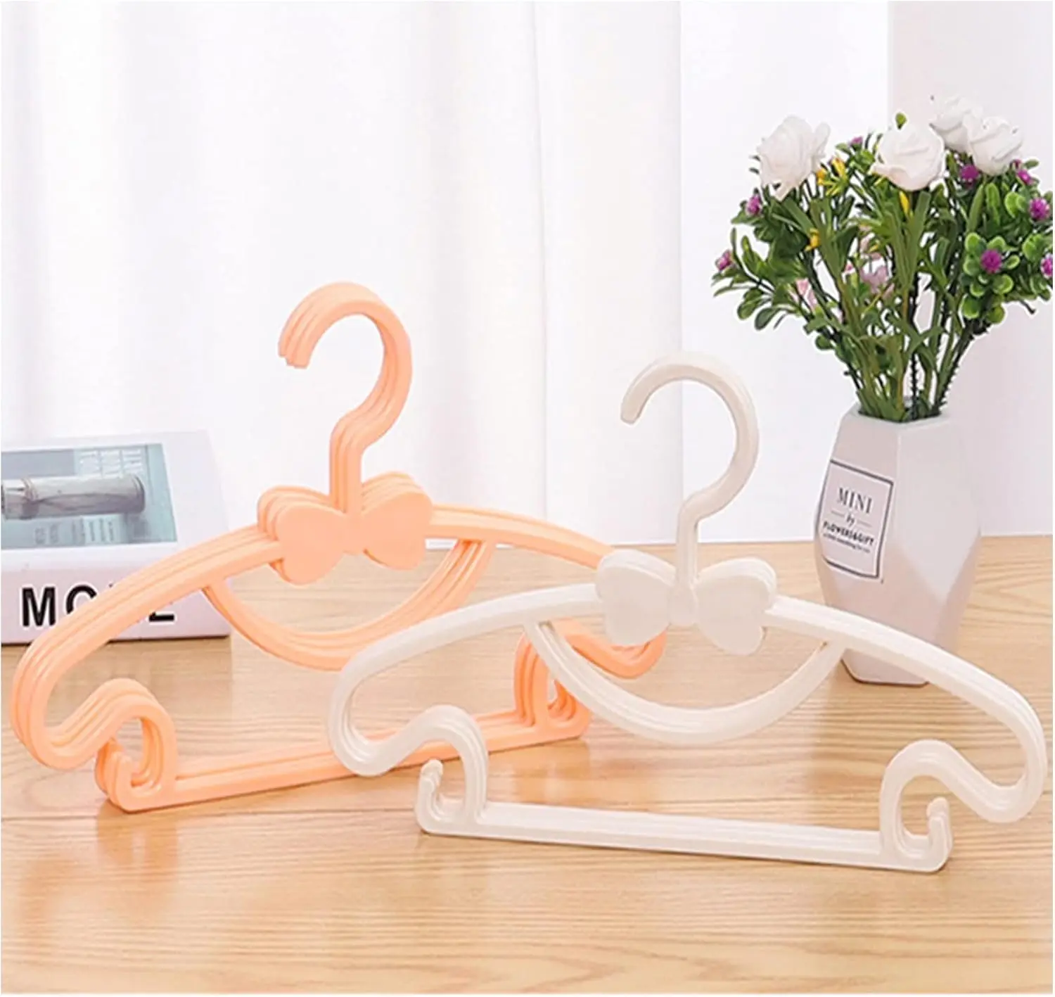 Percheros de Plástico para Rop - Baby Clothing Display reseña y precio